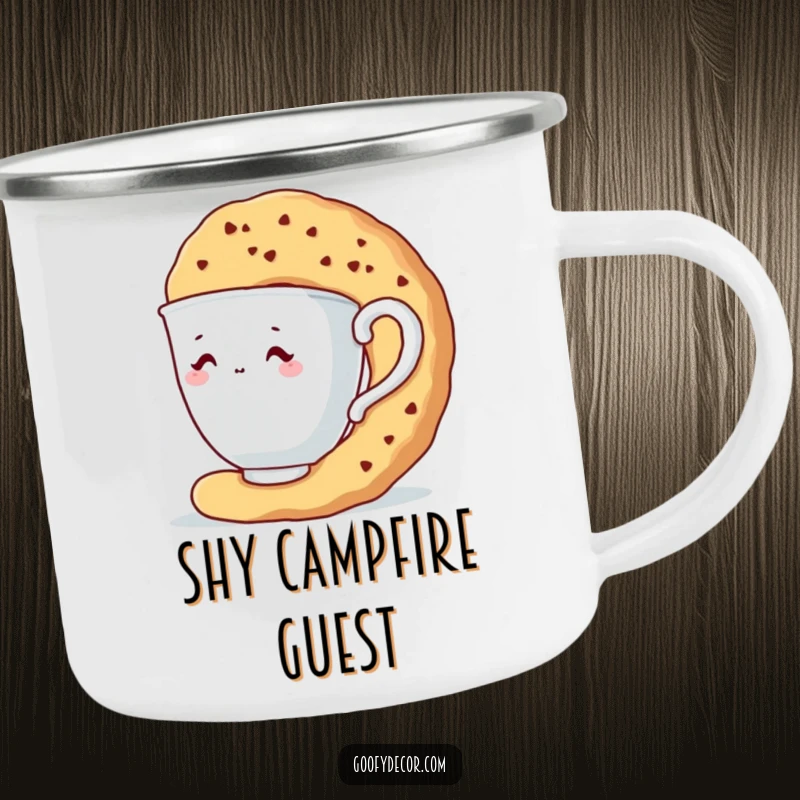Funny camping mug showcasing a shy teacup character hiding behind a large biscuit during an outdoor trip.