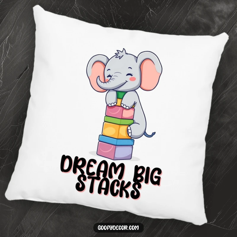 Funny giggling elephant balancing a stack of blocks on a soft and humorous plush pillow.
