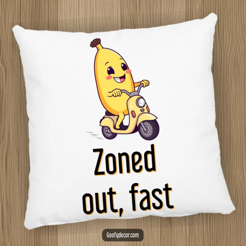 Funny pillow with a grinning banana riding a scooter, offering comfort and a humorous touch to any space.