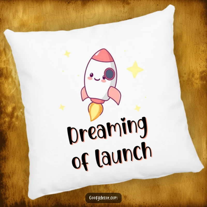 Funny pillow featuring a tiny, happy rocket character zooming through a starry sky, offering comfort and cosmic charm.