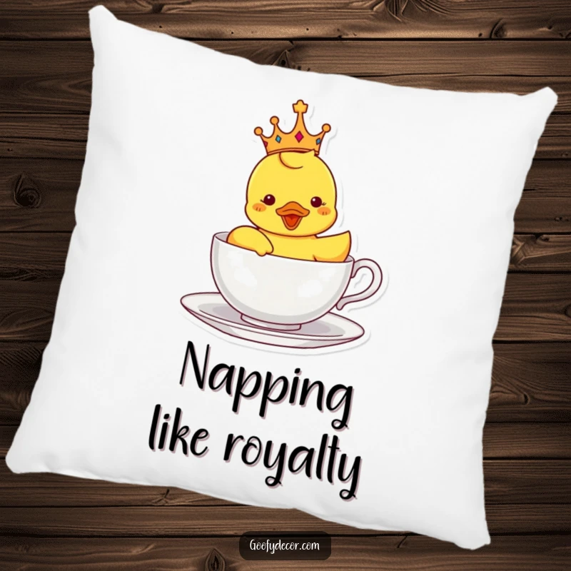 Funny pillow featuring a delighted rubber ducky wearing a crown and sailing in a teacup, perfect for cozy and whimsical accents.