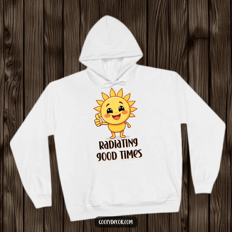 Funny joyful sun character with beaming rays giving a thumbs up on a cozy hoodie, embodying warmth and cheerful comfort.