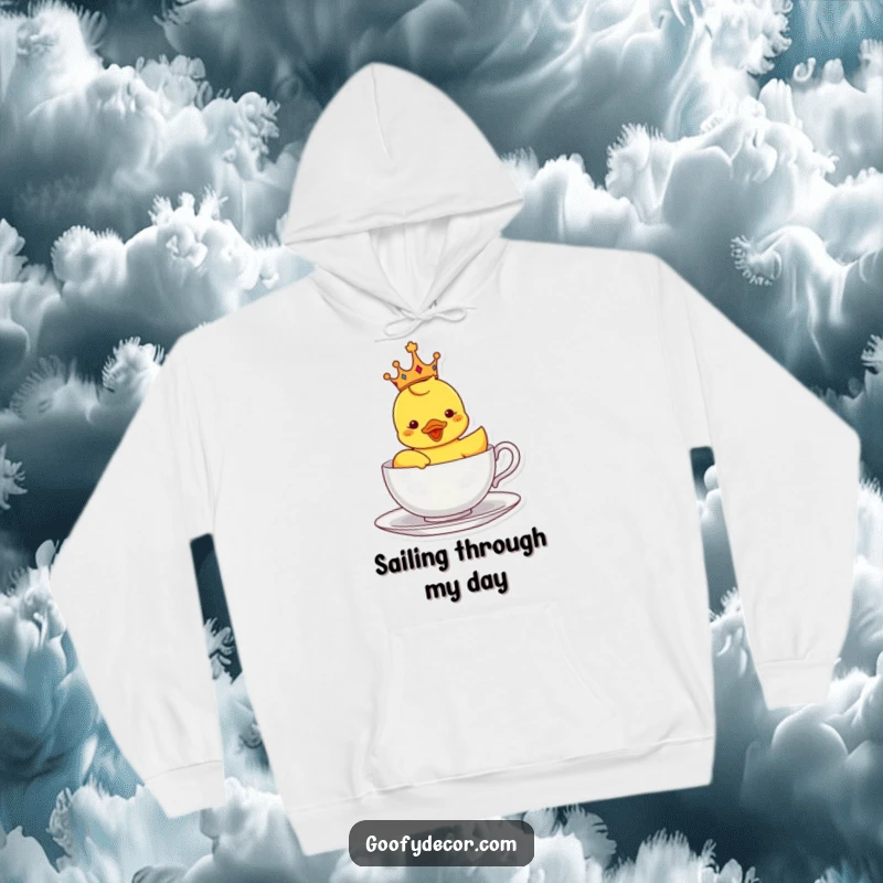 Funny hoodie with a crowned rubber ducky sailing in a teacup, offering cozy comfort and a whimsical, regal theme.