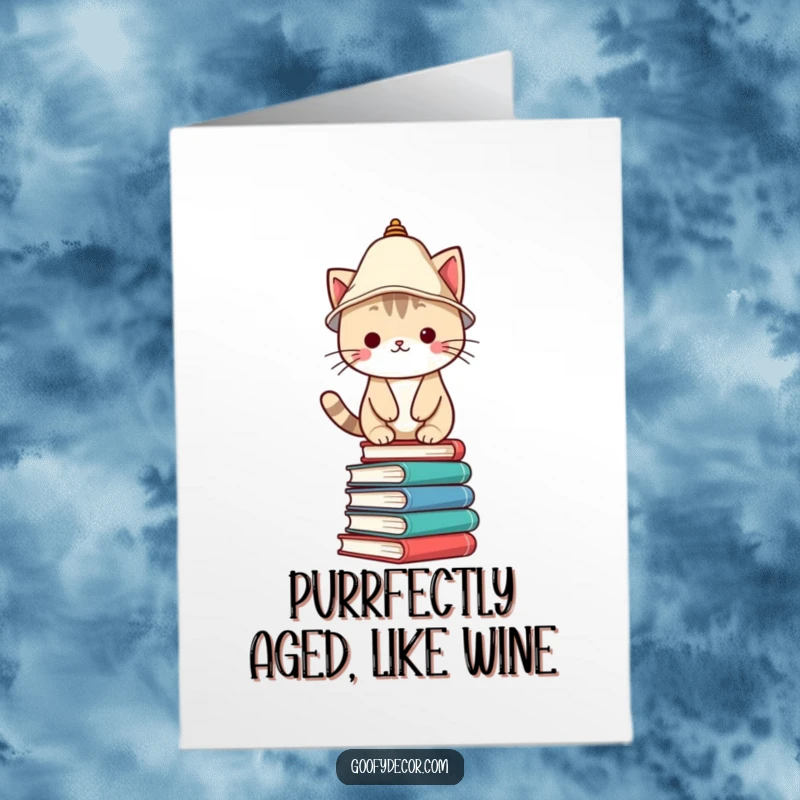 Funny Free Printable Birthday Card featuring a Kawaii cat with a lampshade hat, playfully balancing on stacked books.