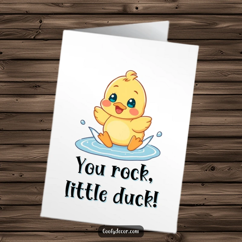 Funny free printable congratulations card showing a happy duckling splashing gleefully in a puddle.