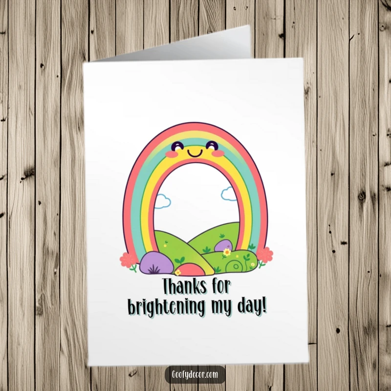 Cheerful Free Printable Thank You Card: A playful rainbow character smiles brightly over a happy landscape to convey thanks.