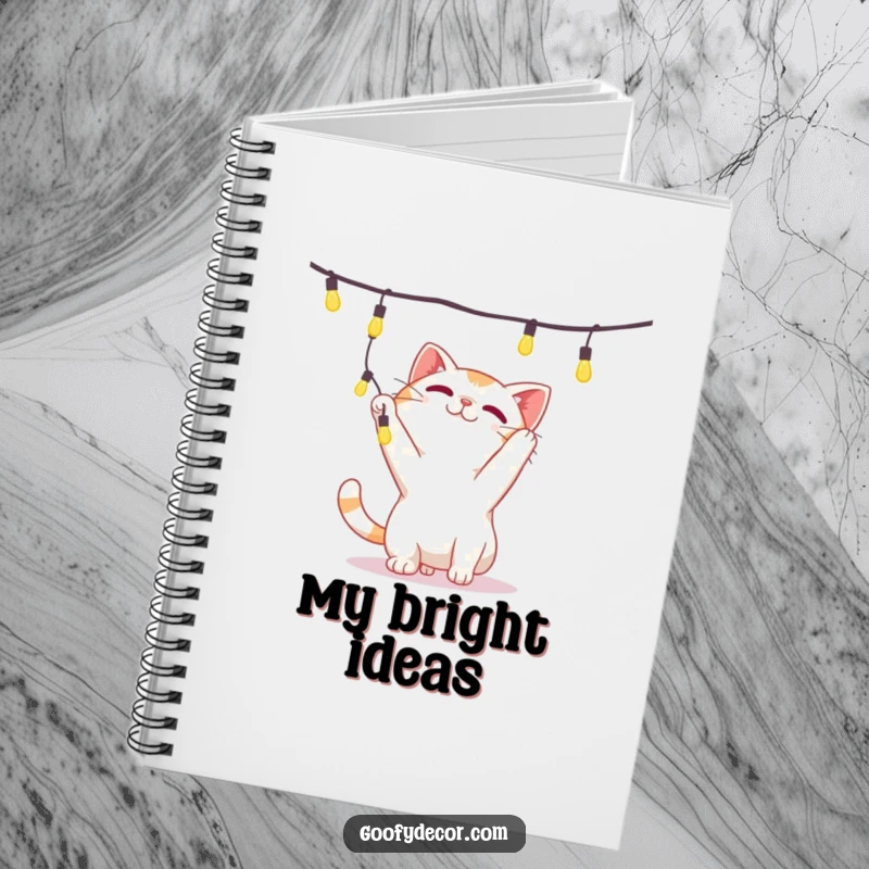 Funny notebook with a playful cat character batting at lights, great for capturing creative and whimsical notes.